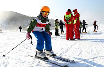 People enjoy skiing across China