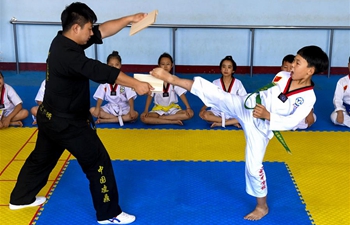 Kids do taekwondo training during summer vacation in China's Hebei