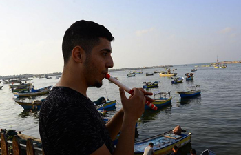 Feature: Gaza's disabled youth turns crutch into flute to express peace hope