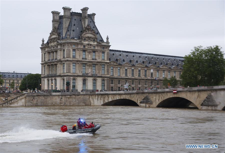 A police boat patrols on the Seine river in front of Louvre museum in Paris, France, June 3, 2016