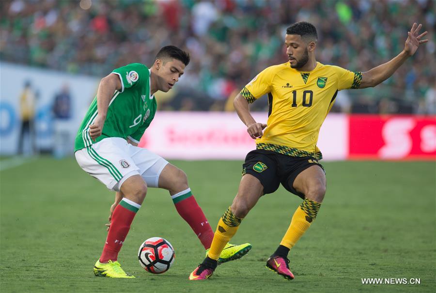 Mexico's Oribe Peralta (R) celebrates after scoring during the Copa America Centenario tournament Group C football match between Mexico and Jamaica in Pasadena, California, the United States, on June 9, 2016 Mexico's Oribe Peralta (R) celebrates after scoring during the Copa America Centenario tournament Group C football match between Mexico and Jamaica in Pasadena, California, the United States, on June 9, 2016