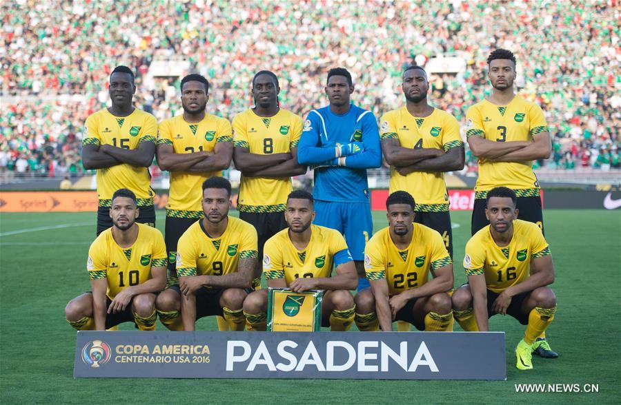 Jamaica's Clayton Donaldson (Top) is tackled during the Copa America Centenario tournament Group C football match between Mexico and Jamaica in Pasadena, California, the United States, on June 9, 2016.