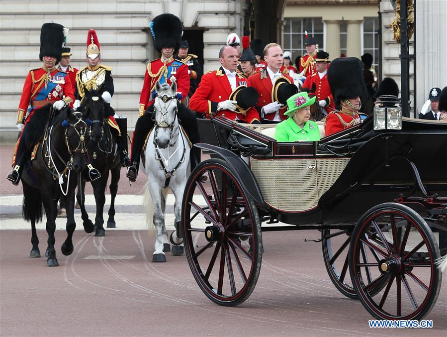 Britain's Queen Elizabeth II and her husband Prince Philip leave Buckingham Palace to attend the Queen's Birthday Parade 'Trooping the Color' during the Queen's 90th official birthday celebrations in London, Britain on June 11, 2016.