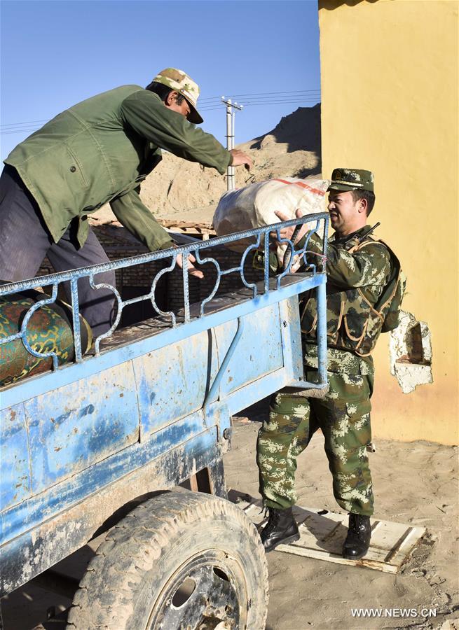 Frontier guards helped Kirgiz nomads move to their summer pasture over the border areas of some 4,000 meters above the sea level here in Xinjiang