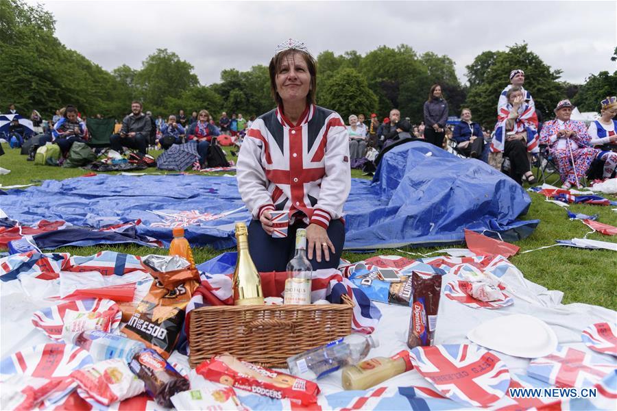 People celebrate Queen Elizabeth II's official 90th birthday at Trafalgar Square in London, June 12, 2016.