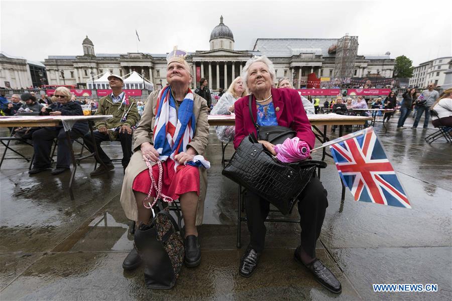 People celebrate Queen Elizabeth II's official 90th birthday at Trafalgar Square in London, June 12, 2016. People celebrate Queen Elizabeth II's official 90th birthday at Trafalgar Square in London, June 12, 2016.
