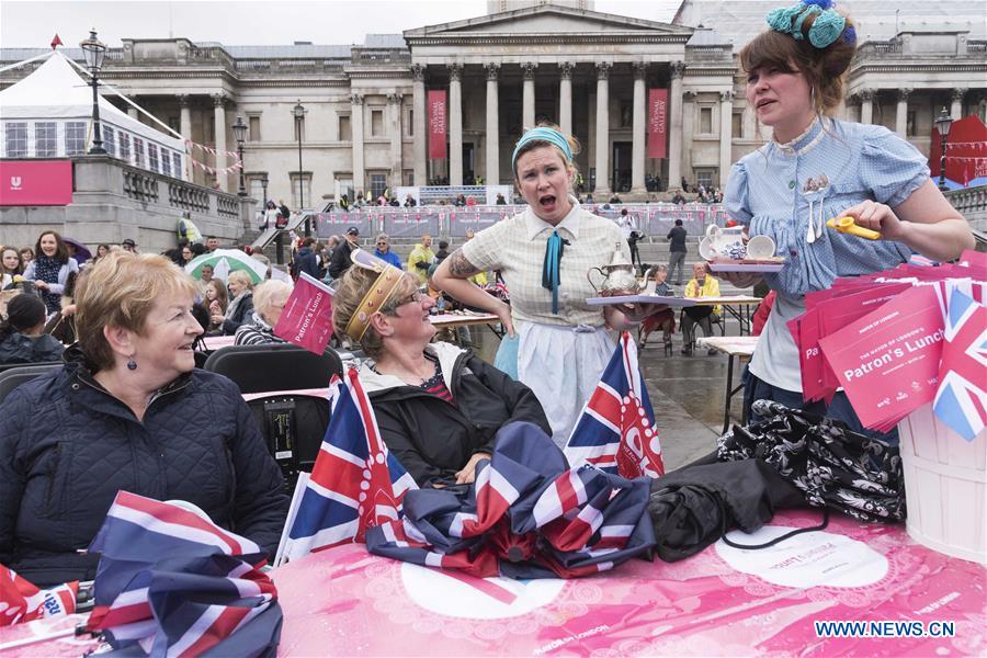 People celebrate Queen Elizabeth II's official 90th birthday at Trafalgar Square in London, June 12, 2016. People celebrate Queen Elizabeth II's official 90th birthday at Trafalgar Square in London, June 12, 2016.