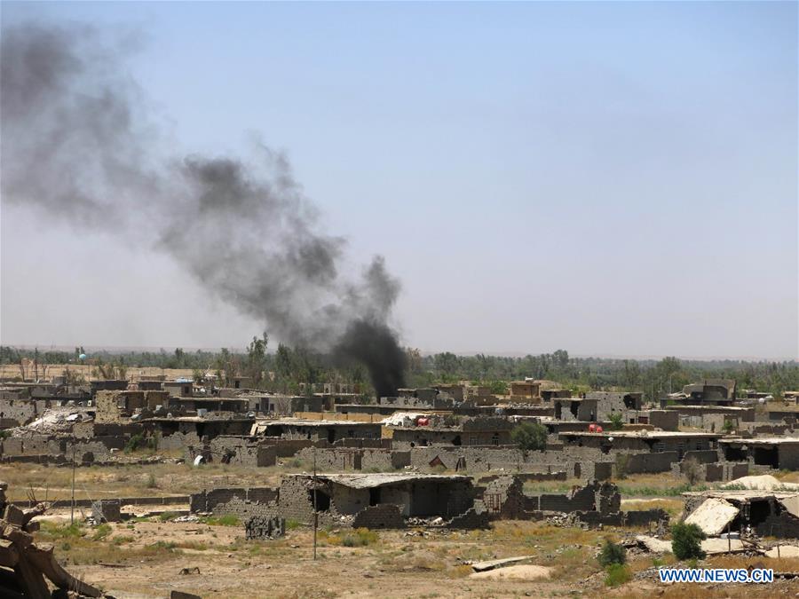 A group of Iraqi army are seen in southern Shuhada district, south Fallujah city in Iraq's western Anbar province, in battles against Islamic State (IS), on June 13, 2016.