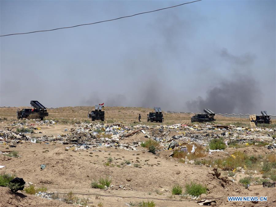 A group of Iraqi army are seen in southern Shuhada district, south Fallujah city in Iraq's western Anbar province, in battles against Islamic State (IS), on June 13, 2016. A group of Iraqi army are seen in southern Shuhada district, south Fallujah city in Iraq's western Anbar province, in battles against Islamic State (IS), on June 13, 2016.
