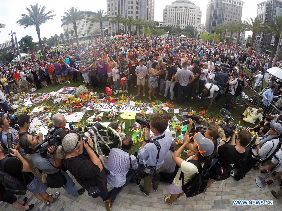 People mourn the victims of the mass shooting during a memorial service in Orlando, the United States, on June 13, 2016. 