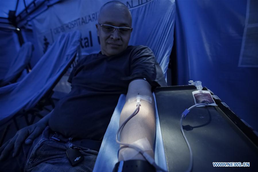 Image taken on June 11, 2016 shows tubes with blood samples in Bogota, capital of Colombia. According to Colombia's Health Ministry, around 80,000 people receive a blood transfusion in Bogota each year. 