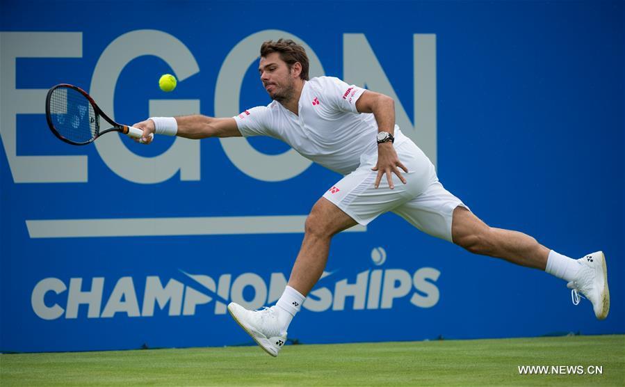 Stan Wawrinka of Switzerland returns a shot during his singles first round match against Fernando Verdasco of Spain during day two of the ATP-500 Aegon Championships at the Queen's Club in London, Britain on June 14, 2016