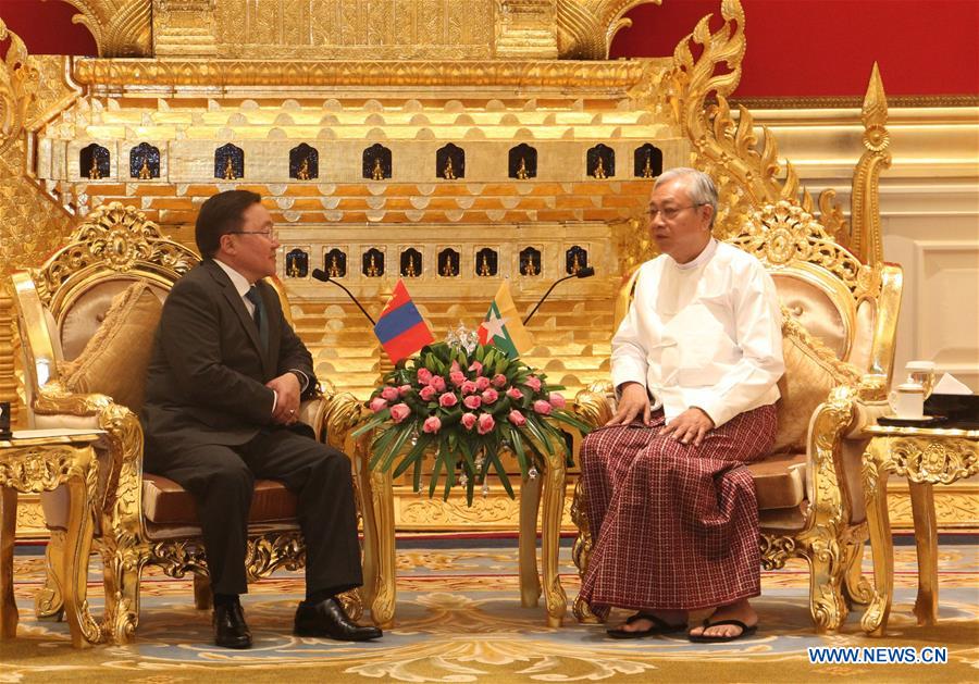 Myanmar's President U Htin Kyaw (R, front) shakes hands with Mongolian President Tsakhiagiin Elbegdorj in Nay Pyi Taw, Myanmar, on June 15, 2016