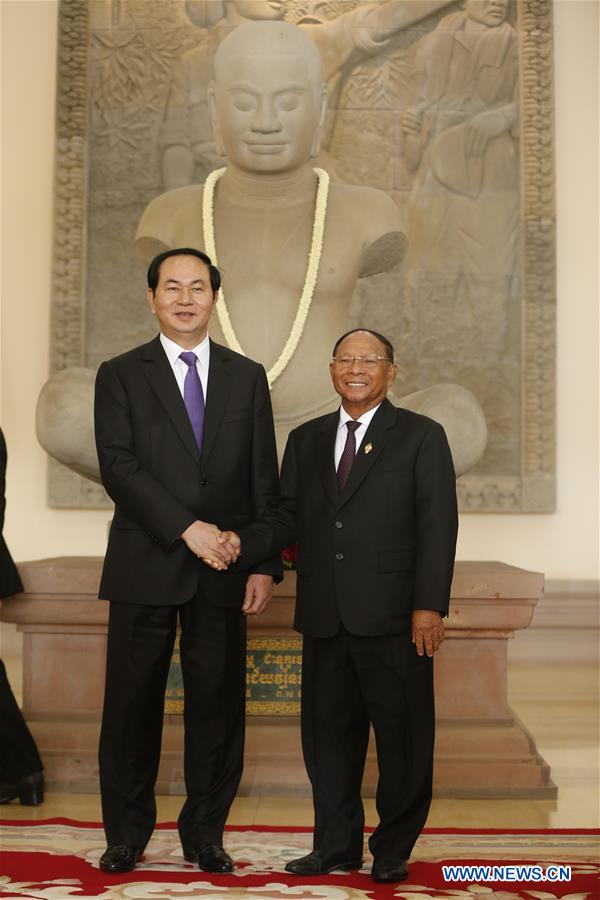Cambodian Senate President Samdech Say Chhum (R) walks with visiting Vietnamese President Tran Dai Quang in Phnom Penh, Cambodia, on June 15, 2016. Cambodian Senate President Samdech Say Chhum (R) walks with visiting Vietnamese President Tran Dai Quang in Phnom Penh, Cambodia, on June 15, 2016.