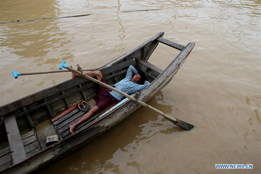 A labor carries bricks at a jetty on the outskirts of Yangon, Myanmar, June 16, 2016. A labor carries bricks at a jetty on the outskirts of Yangon, Myanmar, June 16, 2016.