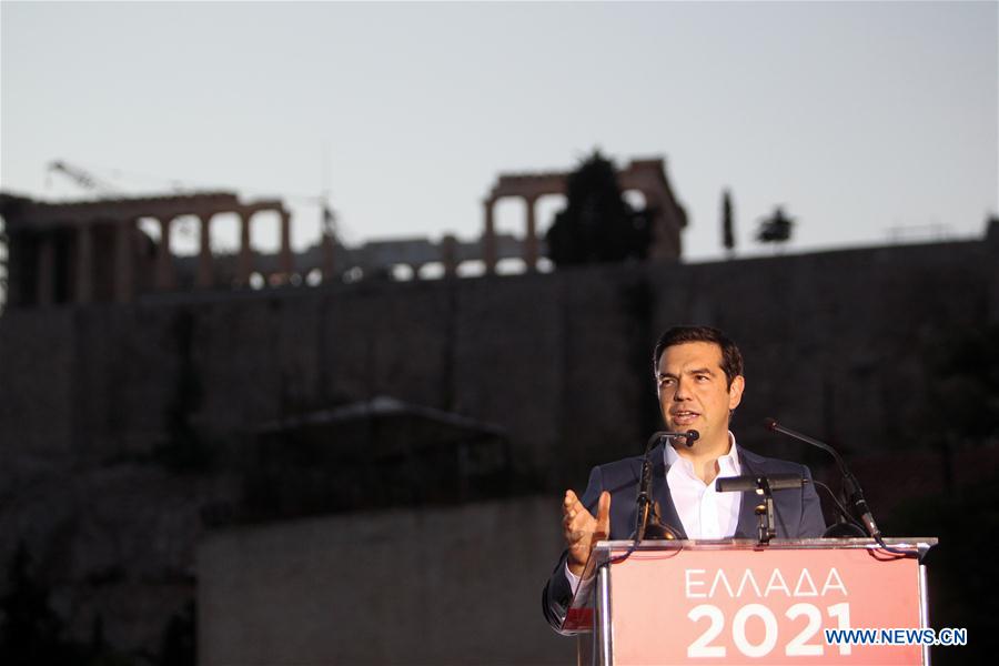 Greek Prime Minister Alexis Tsipras delivers a speech at the Acropolis museum with the ancient Parthenon temple seen in the background in Athens, Greece, June 16, 2016. 