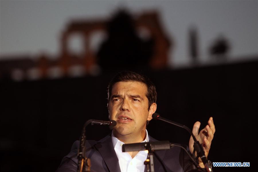 Greek Prime Minister Alexis Tsipras delivers a speech at the Acropolis museum with the ancient Parthenon temple seen in the background in Athens, Greece, June 16, 2016. 