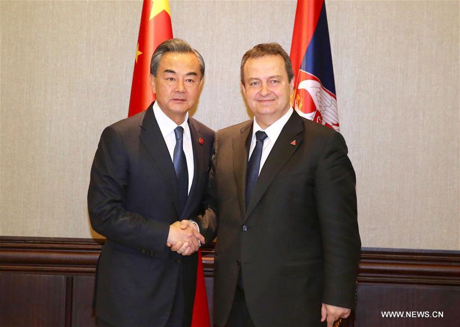 Chinese Foreign Minister Wang Yi (L) shakes hands with Ivica Dacic, Serbia's first deputy prime minister and foreign minister, in Belgrade, Serbia, June 17, 2016 Chinese Foreign Minister Wang Yi (L) shakes hands with Ivica Dacic, Serbia's first deputy prime minister and foreign minister, in Belgrade, Serbia, June 17, 2016