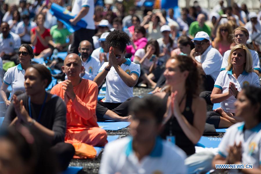 People attend the celebration of the 2016 International Day of Yoga at the United Nations headquarters in New York, June 21, 2016. 