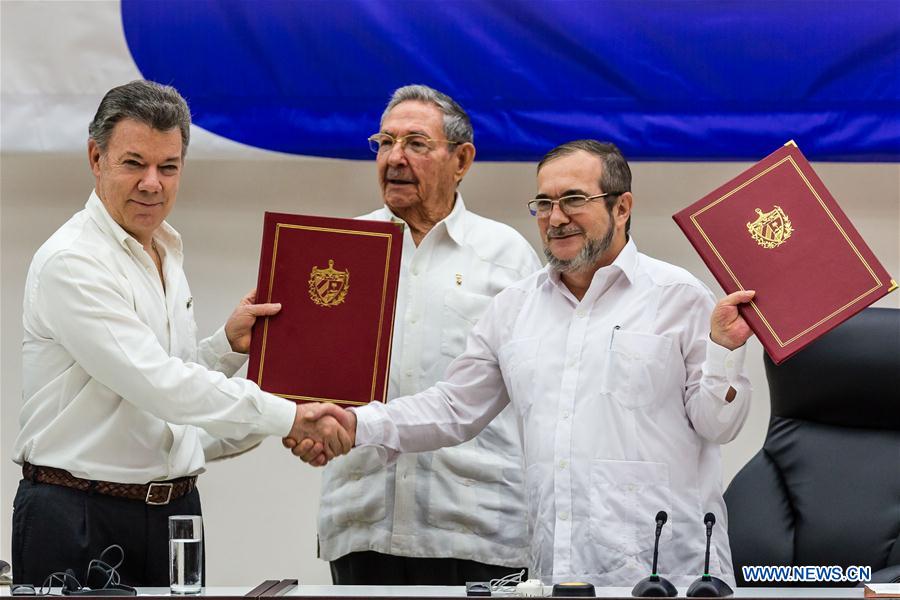 The Colombian government and the FARC guerrilla group signed a pact on a definitive bilateral ceasefire, marking a major step towards ending a half-century conflict. The conflict had killed more than 220,000 people and displaced millions since 1964. The Colombian government and the FARC guerrilla group signed a pact on a definitive bilateral ceasefire, marking a major step towards ending a half-century conflict. The conflict had killed more than 220,000 people and displaced millions since 1964.
