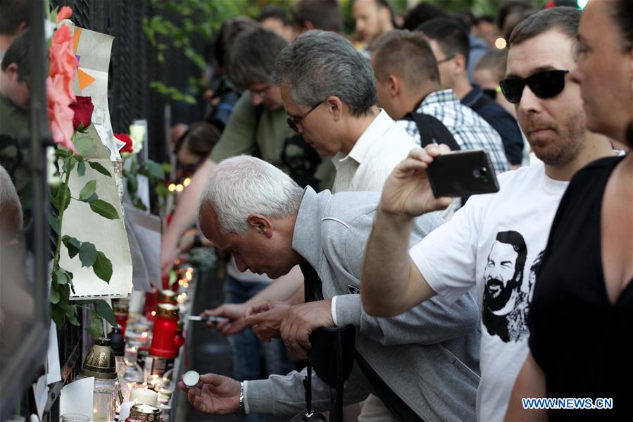 Fans light candles to mourn Italian actor and filmmaker Bud Spencer in front of the Italian Embassy in Budapest, Hungary, on June 28, 2016.