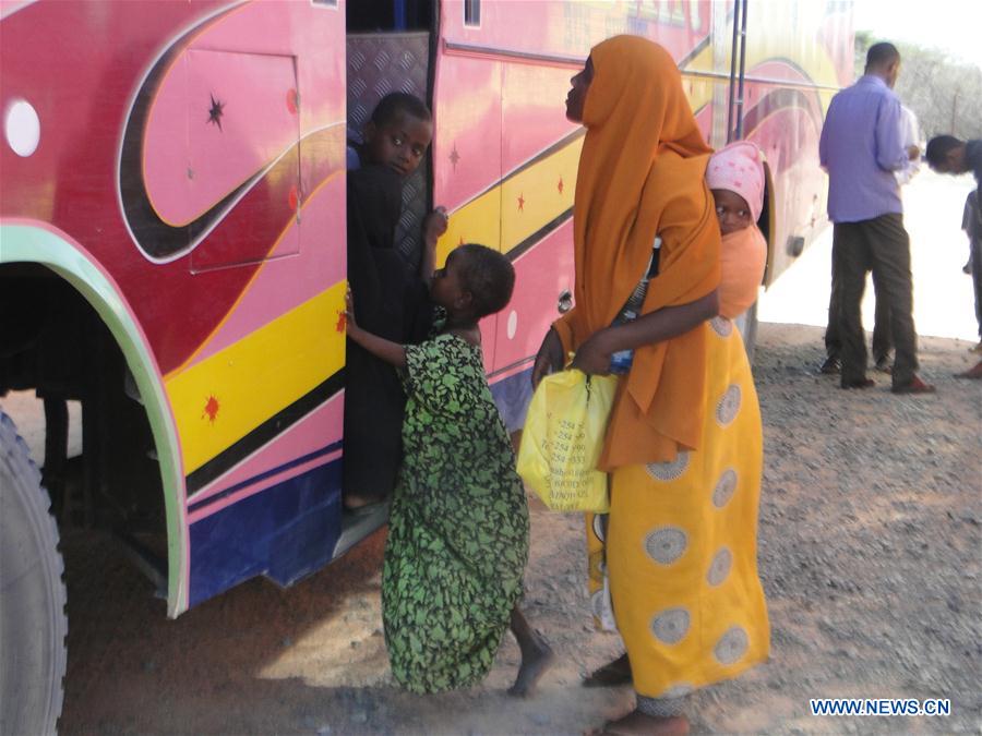 A Somali refugee girl looks out after getting on a bus heading for Somalia at Dadaab in Garissa, Kenya, July 1, 2016