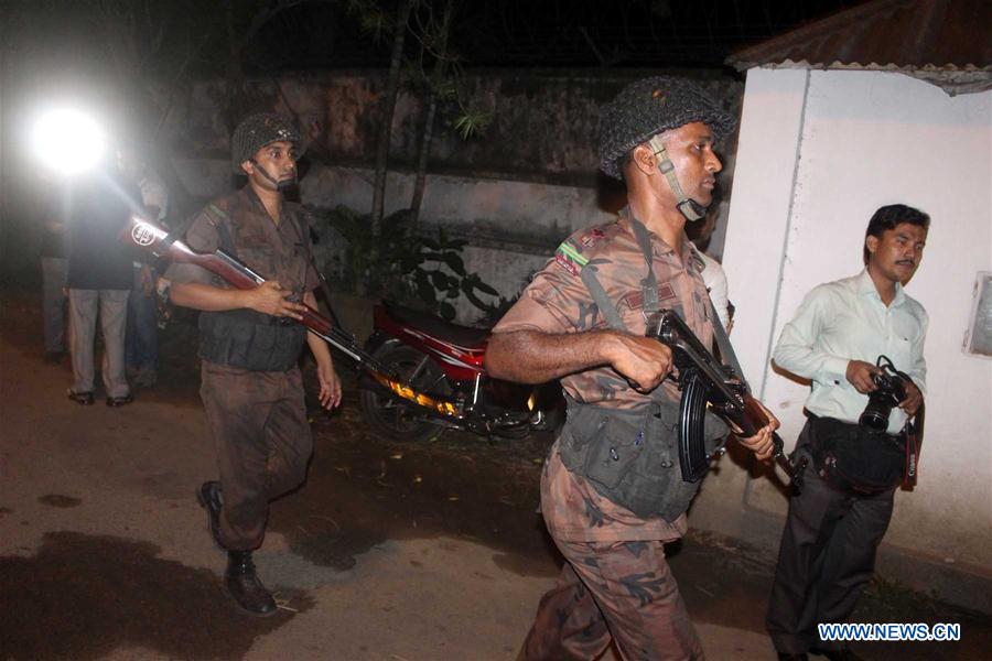 Security personnel stand guard near a restaurant attacked by gunmen in Dhaka, Bangladesh, July 2, 2016. Security personnel stand guard near a restaurant attacked by gunmen in Dhaka, Bangladesh, July 2, 2016.
