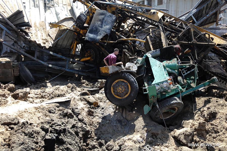 Israeli air strikes hit four sites in the Gaza Strip, causing damage but no injuries, officials said, after Palestinian militants fired a rocket that struck a building in southern Israel.