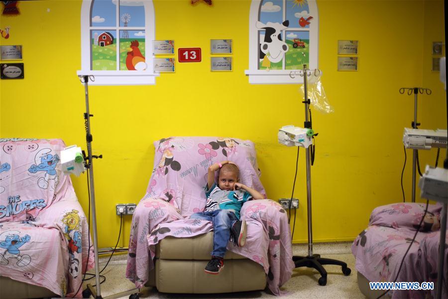 Photo taken on July 3, 2016 shows a child receiving medical treatment at the Children's Cancer Hospital Egypt 57357 in Cairo, Egypt.