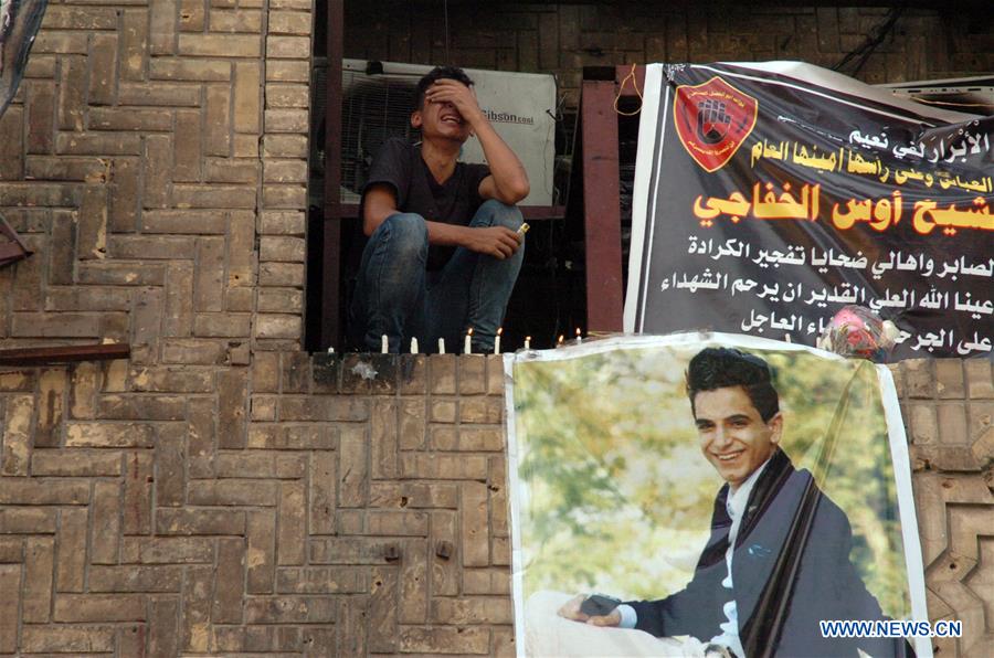People carry a coffin as they mourn for the victims killed in Sunday's car bombing attacks in Karrada-Dakhil district in southern Baghdad, Iraq, on July 5, 2016.