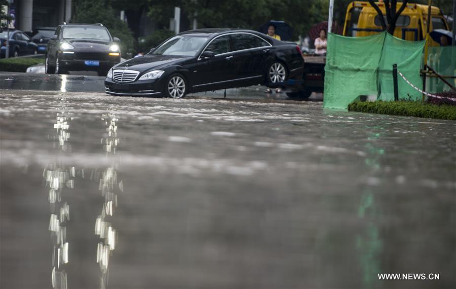 The downpour caused severe waterlogging as rivers, lakes and reservoirs of the city have swollen, leading to closure of a tunnel across the Yangtze as well as some subway stations and underground passages, according to local traffic authorities. 