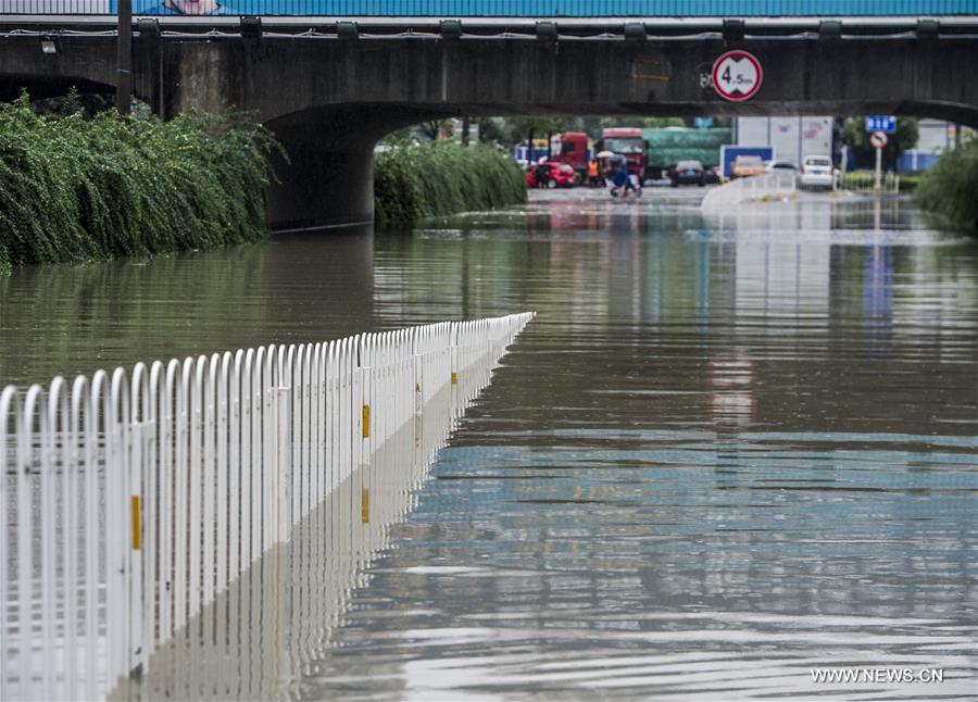 The downpour caused severe waterlogging as rivers, lakes and reservoirs of the city have swollen, leading to closure of a tunnel across the Yangtze as well as some subway stations and underground passages, according to local traffic authorities. 