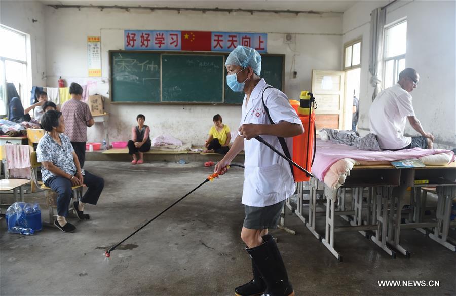 The middle school became a temporary shelter for local people affected by the flood that hit the township recently. The middle school became a temporary shelter for local people affected by the flood that hit the township recently.