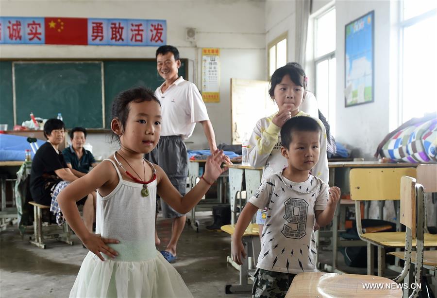 The middle school became a temporary shelter for local people affected by the flood that hit the township recently. The middle school became a temporary shelter for local people affected by the flood that hit the township recently.