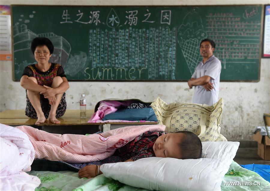 The middle school became a temporary shelter for local people affected by the flood that hit the township recently. The middle school became a temporary shelter for local people affected by the flood that hit the township recently.