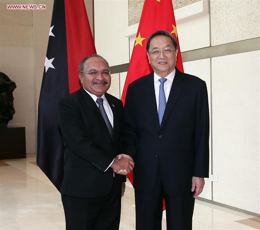 Yu Zhengsheng (R), chairman of the National Committee of the Chinese People's Political Consultative Conference (CPPCC), meets with Peter O'Neill, prime minister of Papua New Guinea, who is visiting China to attend the Eco Forum Global Annual Conference 2016, in Guiyang, capital of southwest China's Guizhou Province, July 8, 2016. 