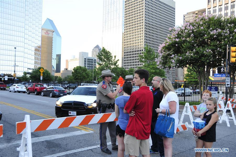An FBI detective works at the scene of shooting of police personnel in Dallas, the United States, July 8, 2016. 