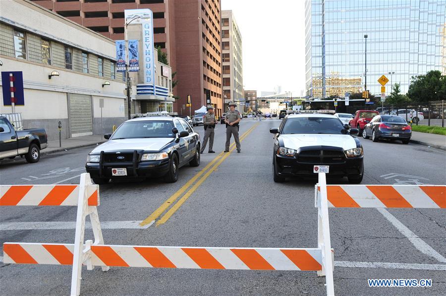 An FBI detective works at the scene of shooting of police personnel in Dallas, the United States, July 8, 2016. An FBI detective works at the scene of shooting of police personnel in Dallas, the United States, July 8, 2016.