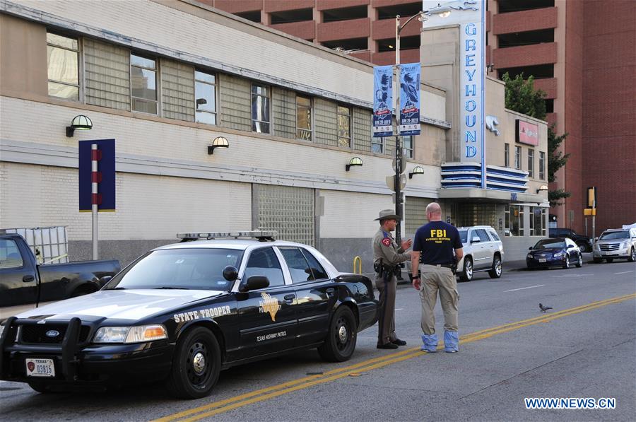 An FBI detective works at the scene of shooting of police personnel in Dallas, the United States, July 8, 2016. An FBI detective works at the scene of shooting of police personnel in Dallas, the United States, July 8, 2016.