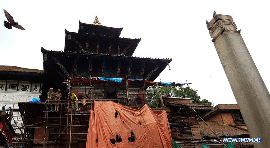 People work at the reconstruction site of a damaged temple at Hanumandhoka Durbar Square, a UNESCO heritage site in Kathmandu, Nepal, July 11, 2016. People work at the reconstruction site of a damaged temple at Hanumandhoka Durbar Square, a UNESCO heritage site in Kathmandu, Nepal, July 11, 2016.