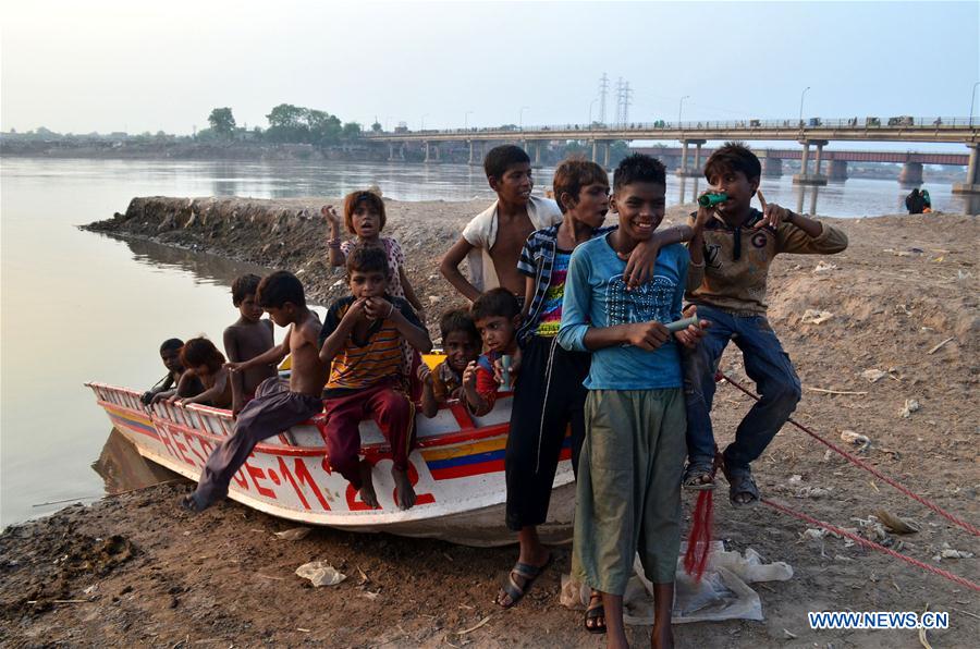 Makeshift tents are seen near Ravi river in eastern Pakistan's Lahore on July 11, 2016.