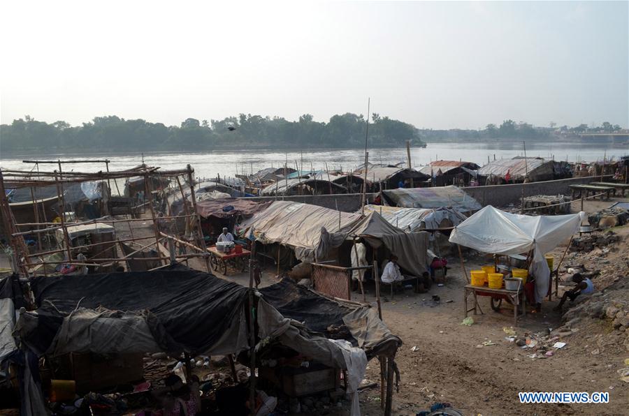 Makeshift tents are seen near Ravi river in eastern Pakistan's Lahore on July 11, 2016.