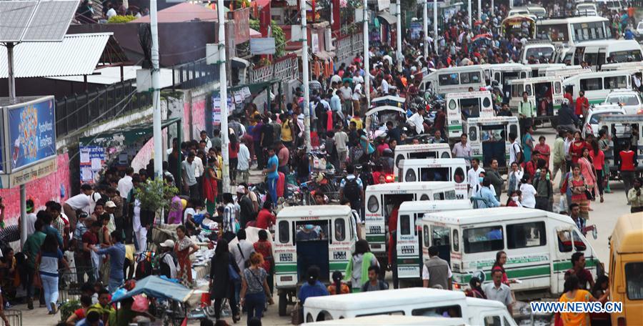 A large number of people are seen at a bus station in Kathmandu, capital of Nepal, on July 11, 2016