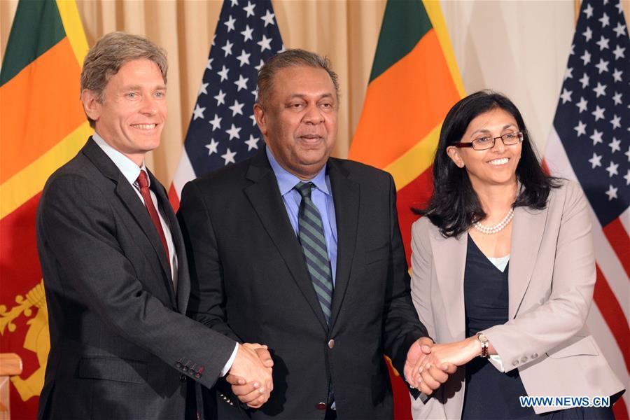 Sri Lankan Foreign Minister Mangala Samaraweera (C) shakes hands with U.S. Assistant Secretary of State for South and Central Asian Affairs Nisha Desai Biswal (R) and U.S. Assistant Secretary of State for Democracy, Human Rights and Labor Tom Malinowski after a meeting in Colombo, Sri Lanka, July 12, 2016. Sri Lankan Foreign Minister Mangala Samaraweera (C) shakes hands with U.S. Assistant Secretary of State for South and Central Asian Affairs Nisha Desai Biswal (R) and U.S. Assistant Secretary of State for Democracy, Human Rights and Labor Tom Malinowski after a meeting in Colombo, Sri Lanka, July 12, 2016.