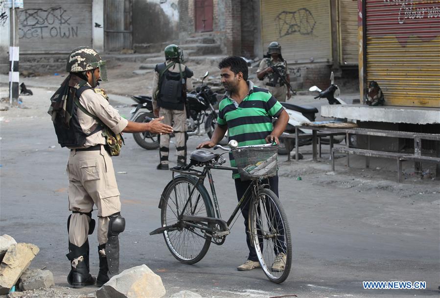 Indian paramilitary troopers patrol on a street during a curfew in Srinagar, summer capital of Indian-controlled Kashmir, July 13, 2016.