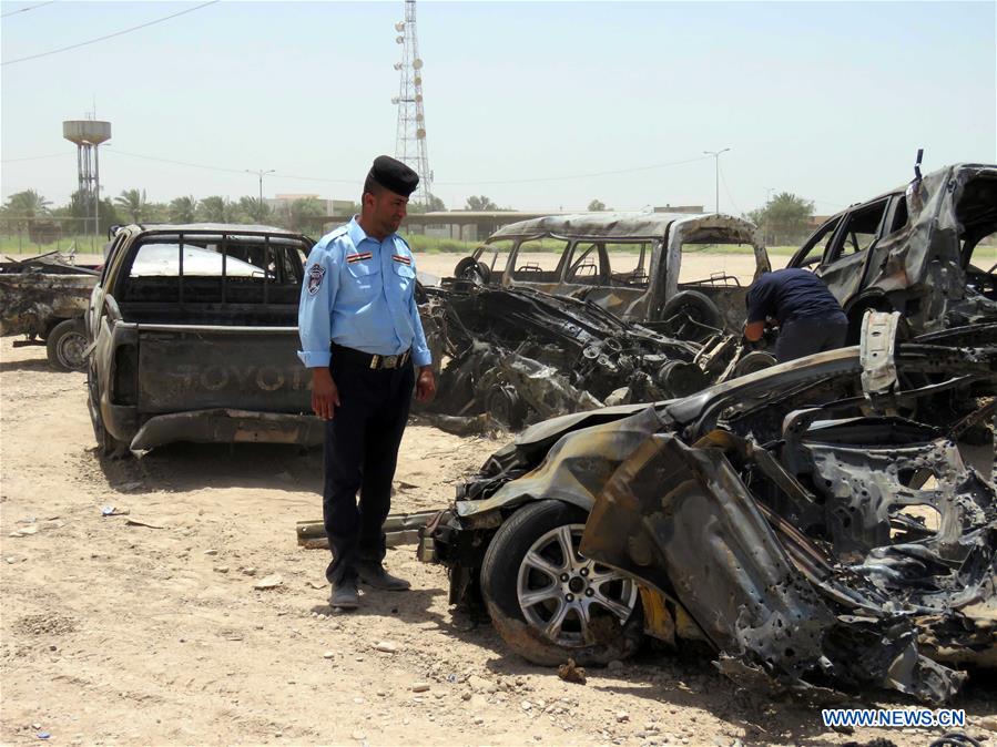 A man inspects a car damaged in an explosion at a crowded checkpoint in Husseiniyah neighborhood in Baghdad, capital of Iraq, on July 13, 2016. A man inspects a car damaged in an explosion at a crowded checkpoint in Husseiniyah neighborhood in Baghdad, capital of Iraq, on July 13, 2016.
