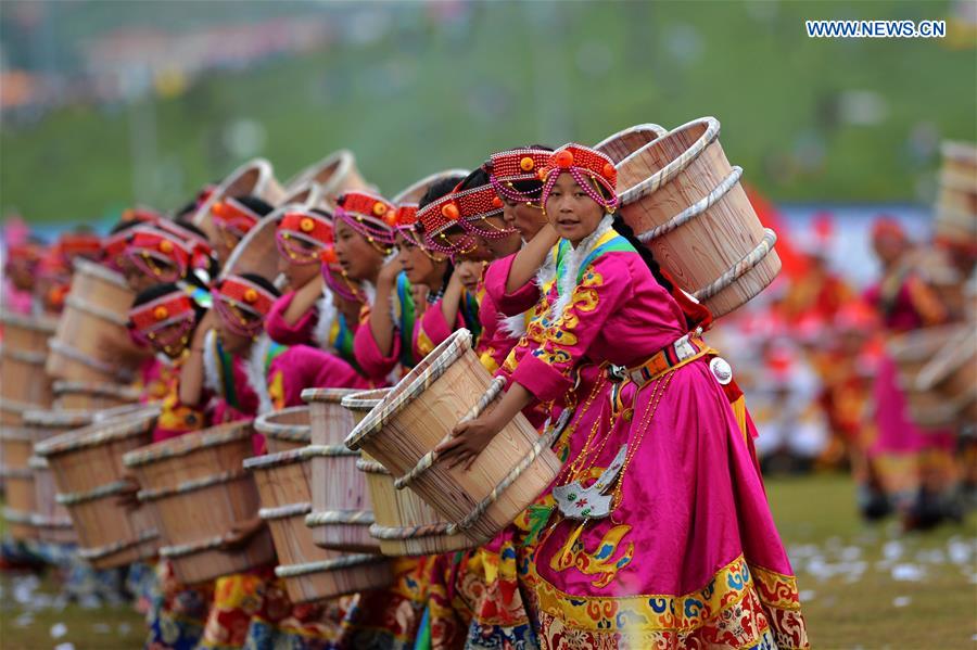 Dancers perform at the opening ceremony of Shambhala Tourism Festival in Gannan, northwest China's Gansu Province, July 17, 2016. 
