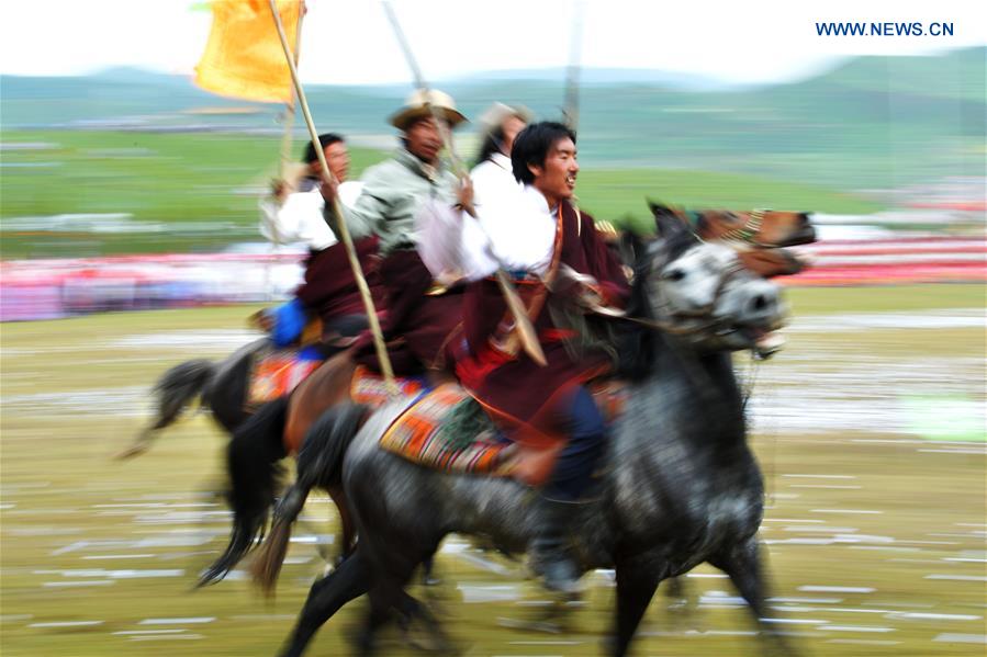 Riders perform the horse racing at the opening ceremony of Shambhala Tourism Festival in Gannan, northwest China's Gansu Province, July 17, 2016. Riders perform the horse racing at the opening ceremony of Shambhala Tourism Festival in Gannan, northwest China's Gansu Province, July 17, 2016.