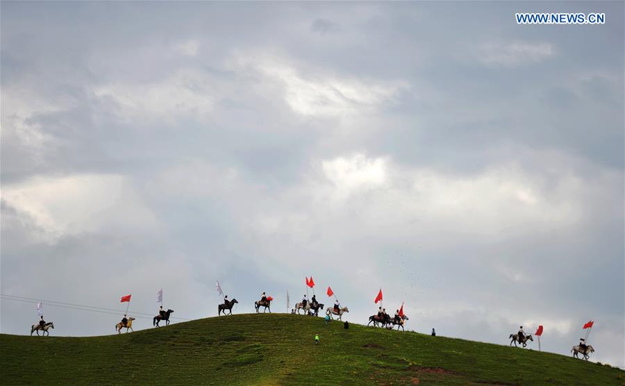 Riders perform at the opening ceremony of Shambhala Tourism Festival in Gannan, northwest China's Gansu Province, July 17, 2016. Riders perform at the opening ceremony of Shambhala Tourism Festival in Gannan, northwest China's Gansu Province, July 17, 2016.