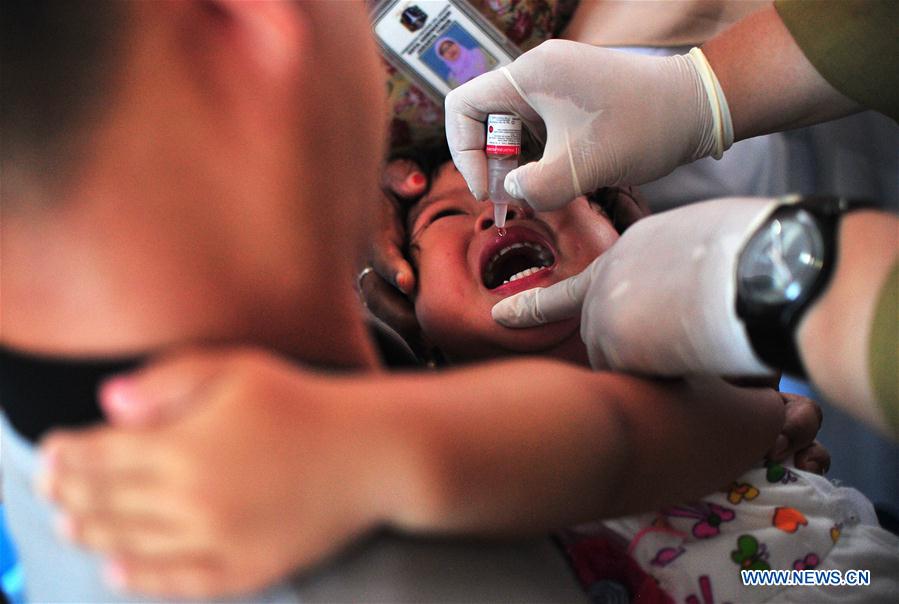 An Indonesian child gets vaccinated at a health center in Jakarta, Indonesia, July 18, 2016. An Indonesian child gets vaccinated at a health center in Jakarta, Indonesia, July 18, 2016.
